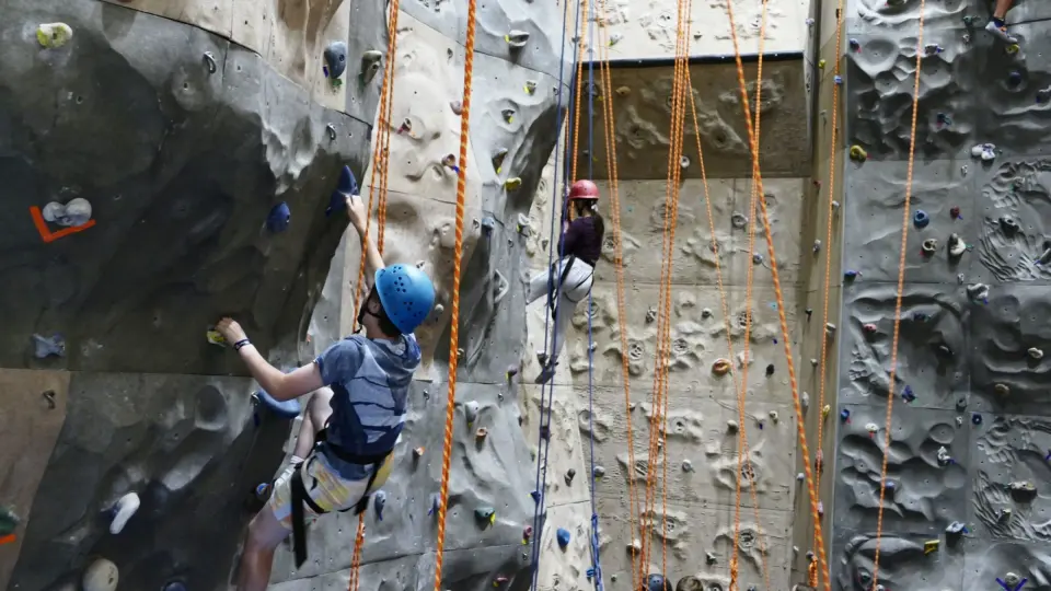Roped climbers on the textured walls of the Rock Barn