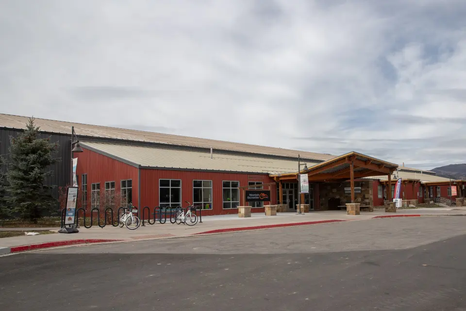 Red-clad exterior and entrance of the Edwards Field House