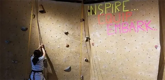 Climber on a top rope at the CSU Pueblo rock wall