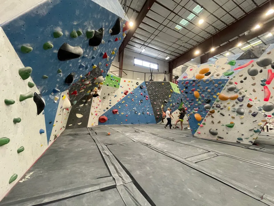 Bouldering walls and matting in the main bouldering area