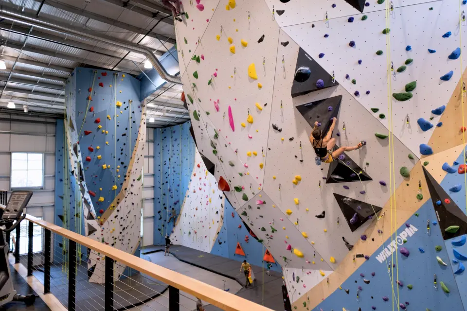 Roped climber on the tall wall, seen from the mezzanine