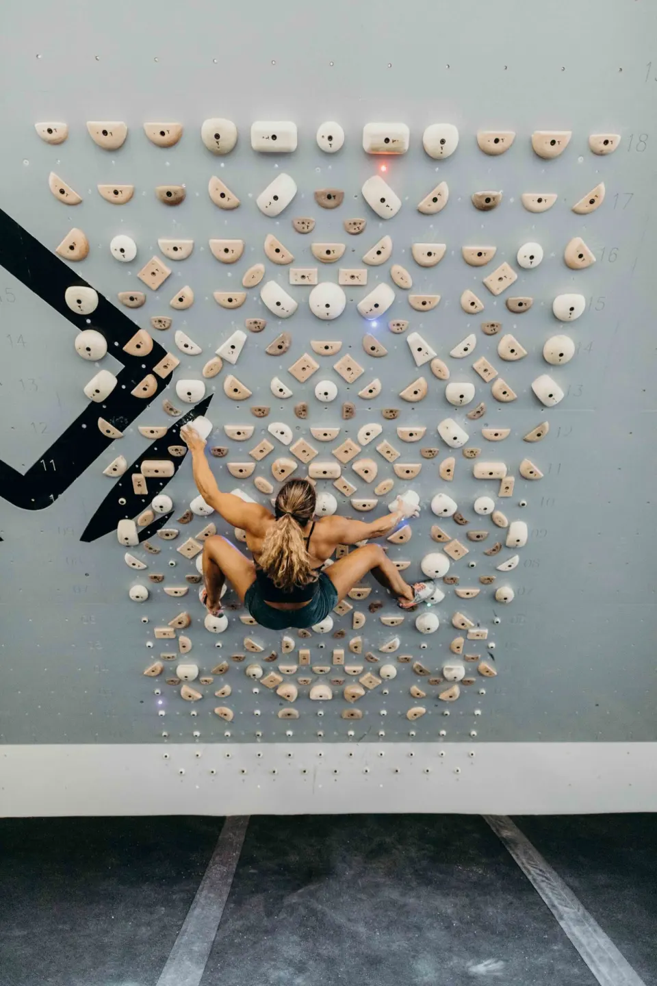 Climber on a symmetrical training board