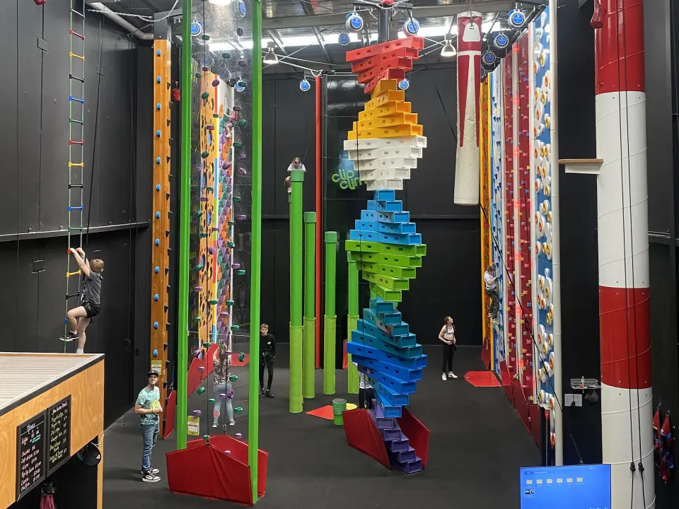 The climbing arena, with the Twister tower, green pillars and auto-belay walls