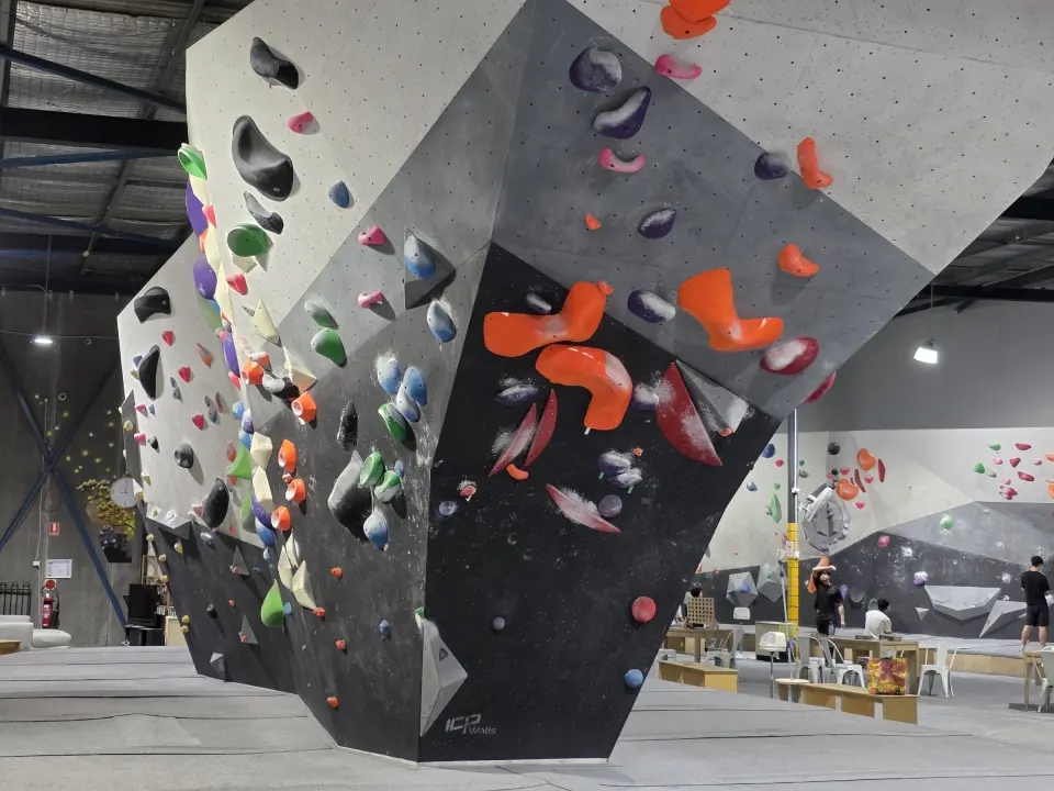 Overhanging island boulder with big orange volumes