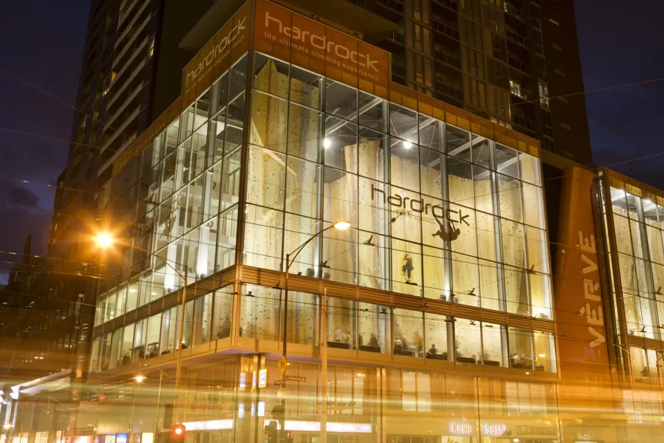 The glass-fronted gym on Franklin Street lit up at night