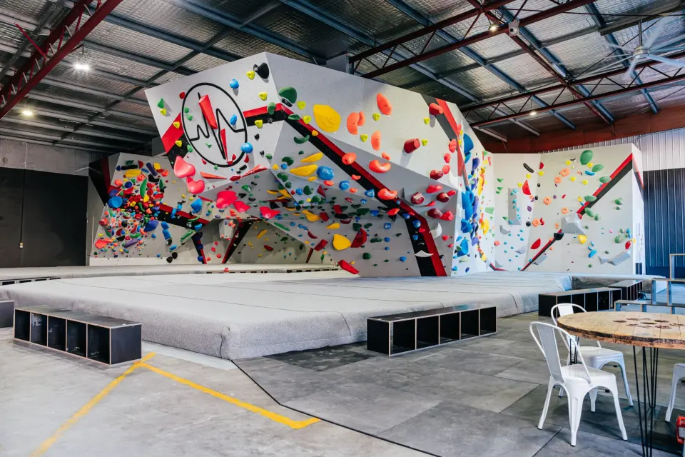 The new bouldering area at Pulse Climbing Adamstown, with grey matting below the walls