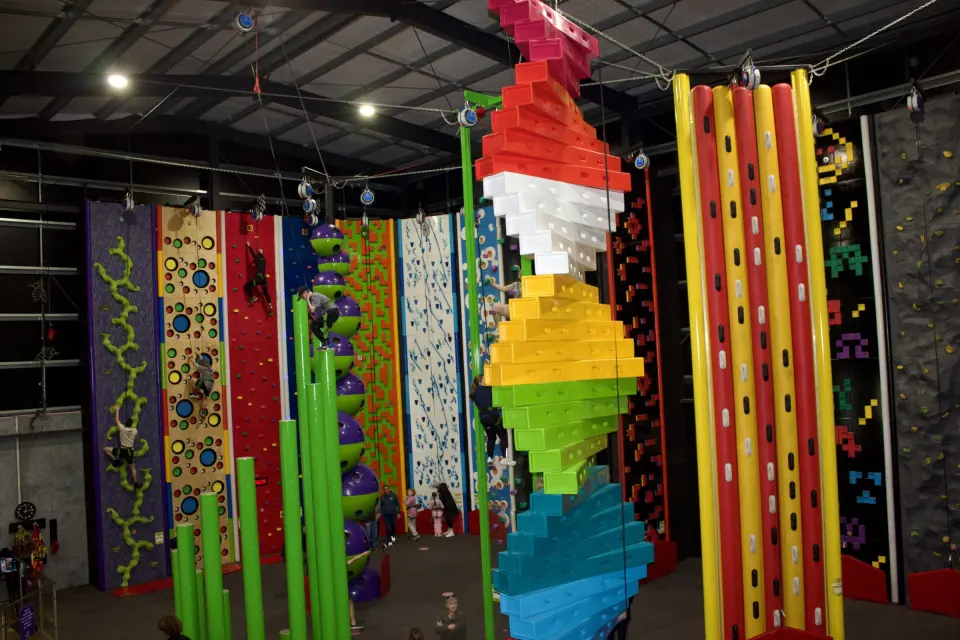 The climbing arena with the Twister, green pillars and colourful challenge walls