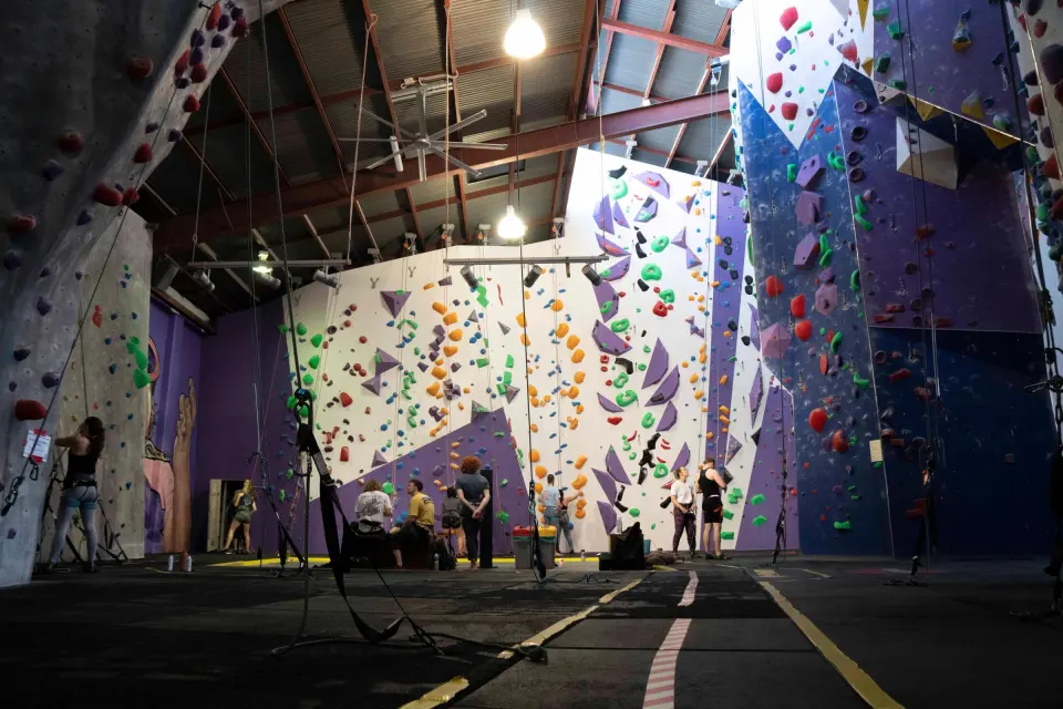 The rope hall, with tall top-rope and lead walls in purple and white