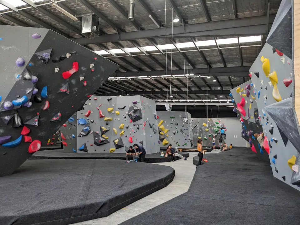 Freestanding boulders and walls across the hall under skylights