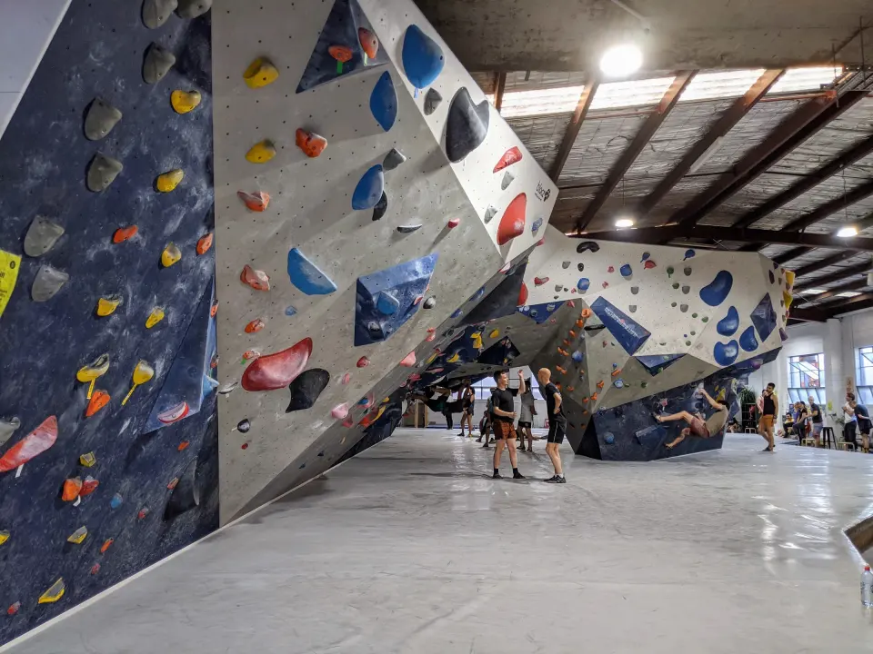Navy and grey bouldering walls along the main hall