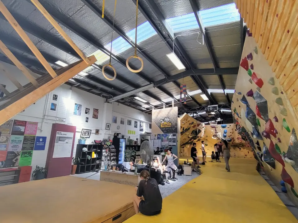 Long view of the hall with hanging rings above the mats