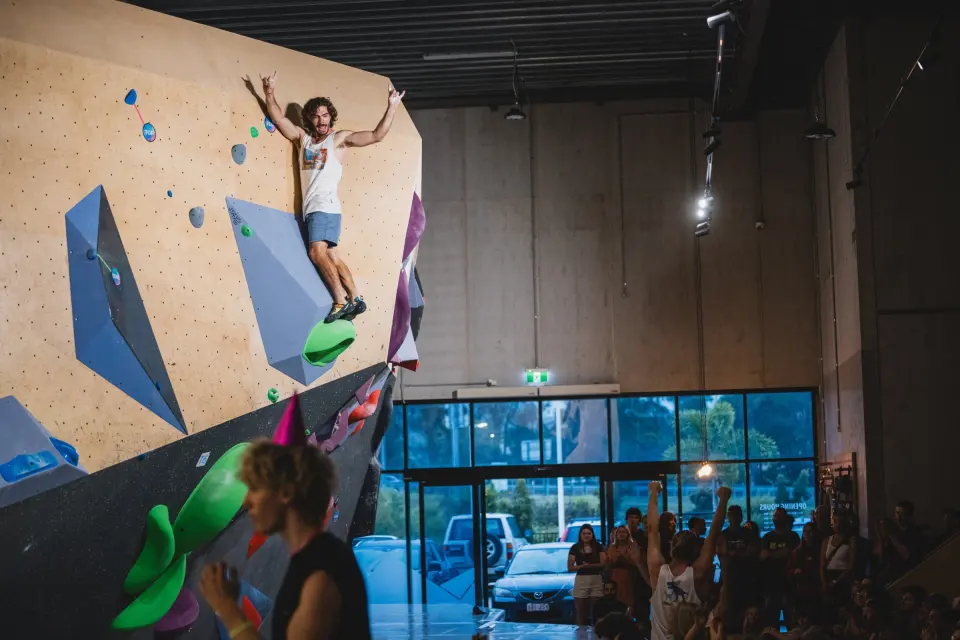 Climber topping out a wall during the AlpineVision finals
