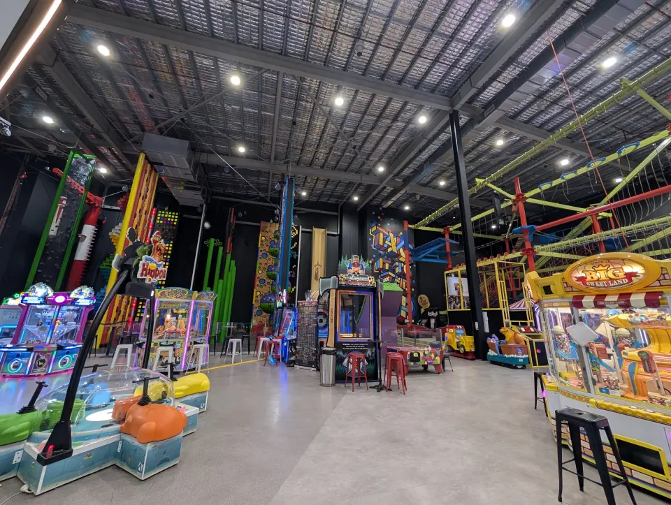 Clip 'n Climb walls along the back of the hall behind the arcade games