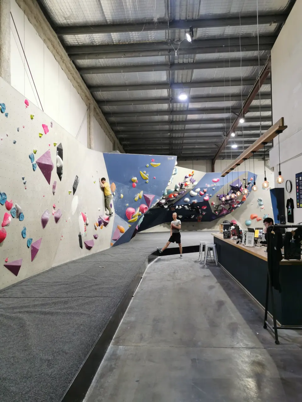 Long view down the gym past the walls and front counter
