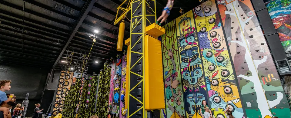 Painted Tribal Climb walls beside the yellow tower