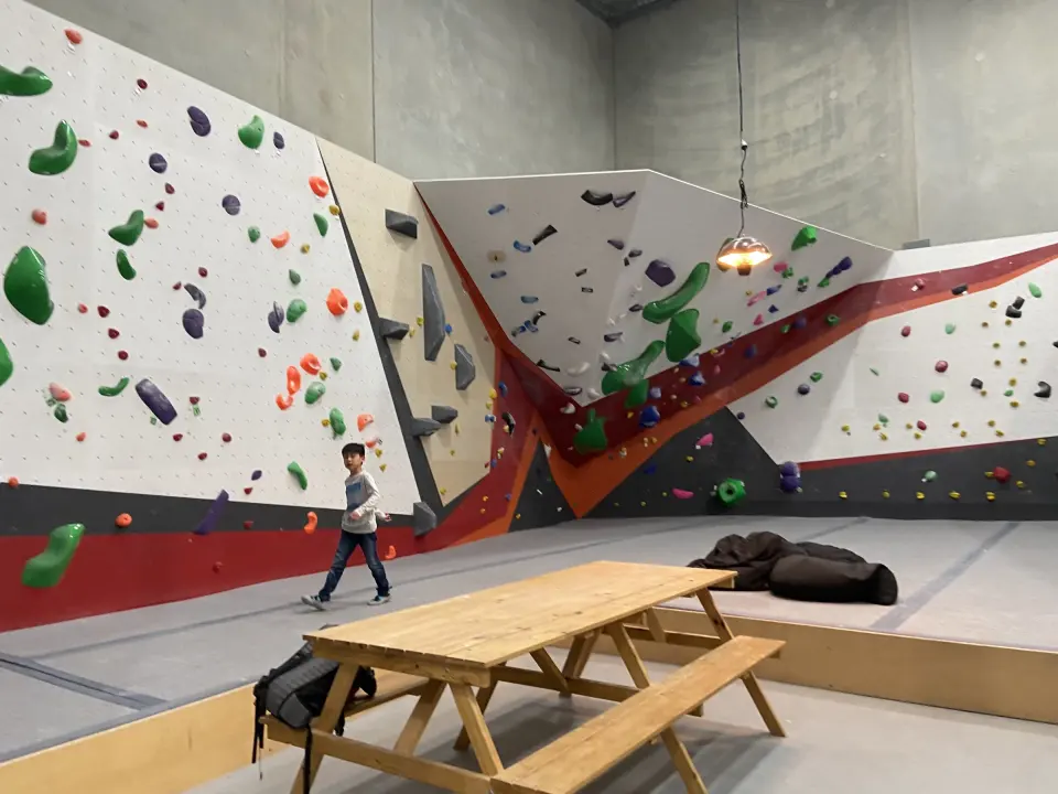 Bouldering wall with an overhanging corner