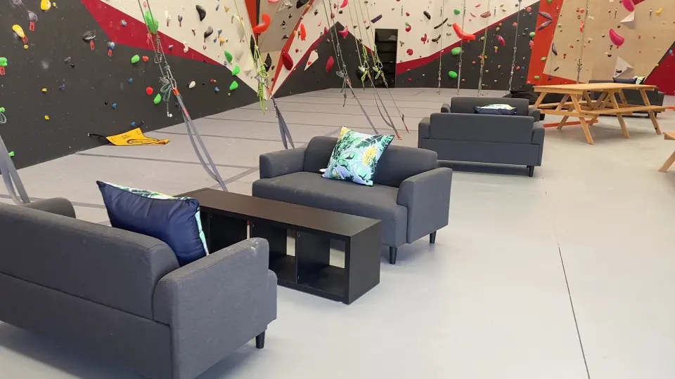 Lounge with sofas beside the climbing walls