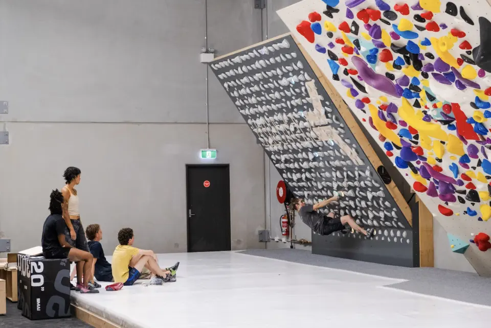 The Kilter Board and spray wall in the training area