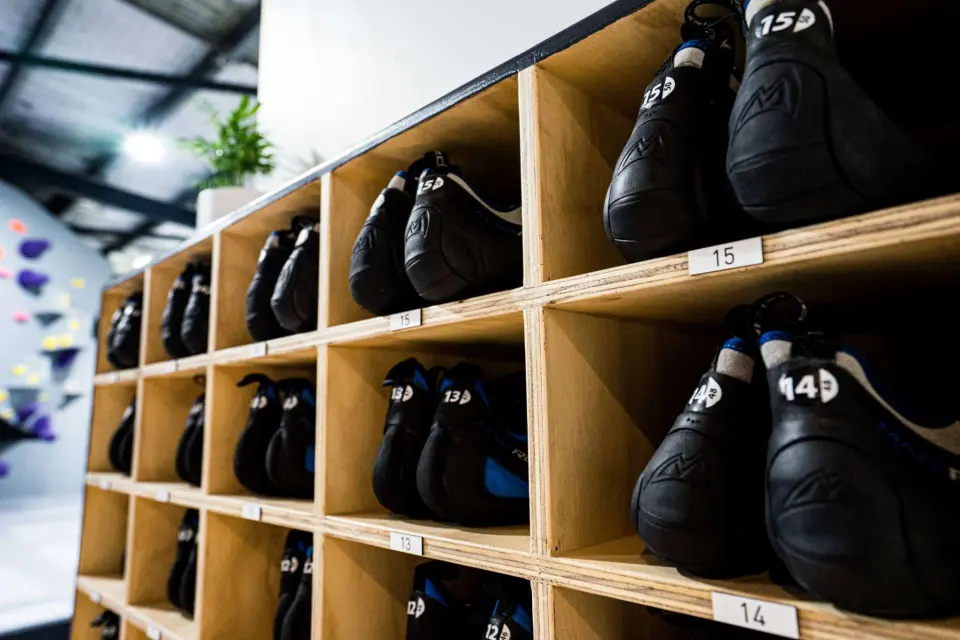 Hire shoes sorted by size in wooden cubbies