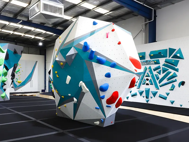 Freestanding boulder in teal and white