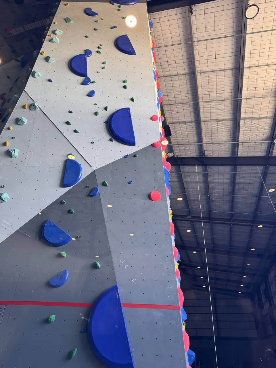 Looking up the 11.5 m roped wall and its blue volumes