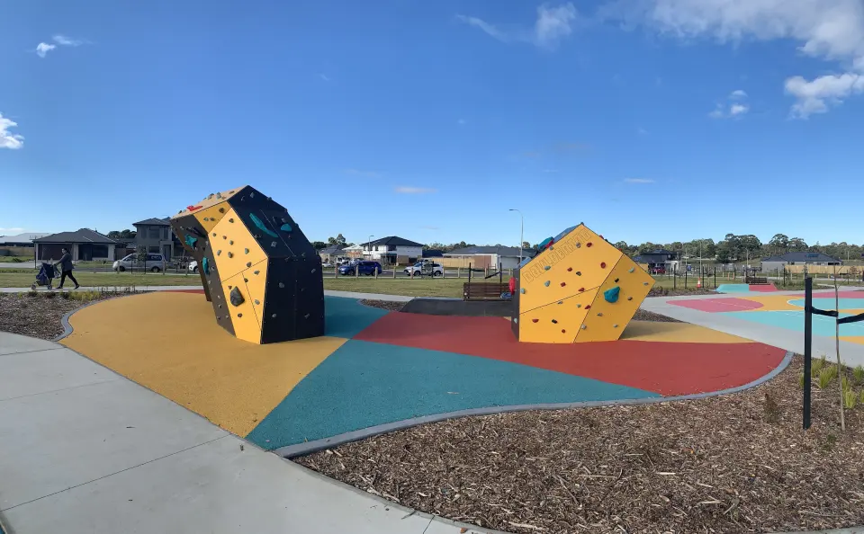 The Titan arch and the Junior boulder on coloured rubber softfall in Edgar Avenue Reserve
