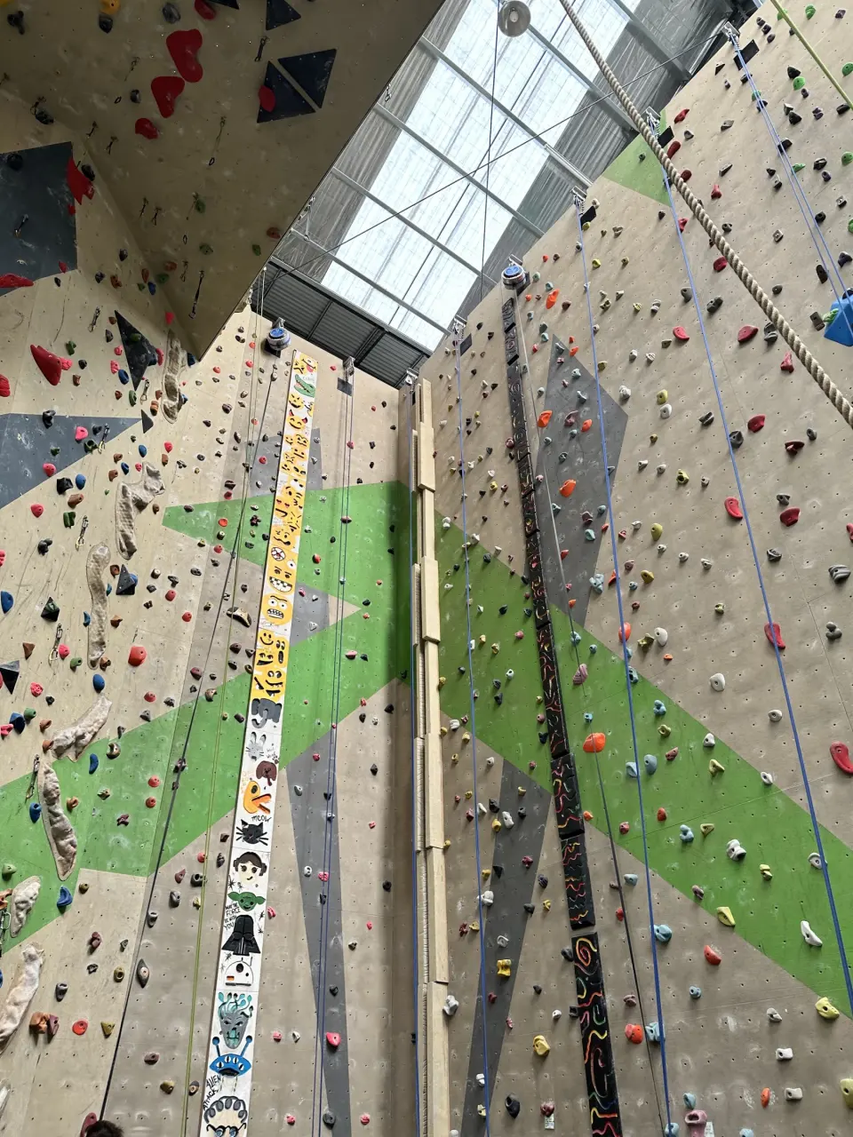 Roped walls with a painted speed-lane strip and a timing pole